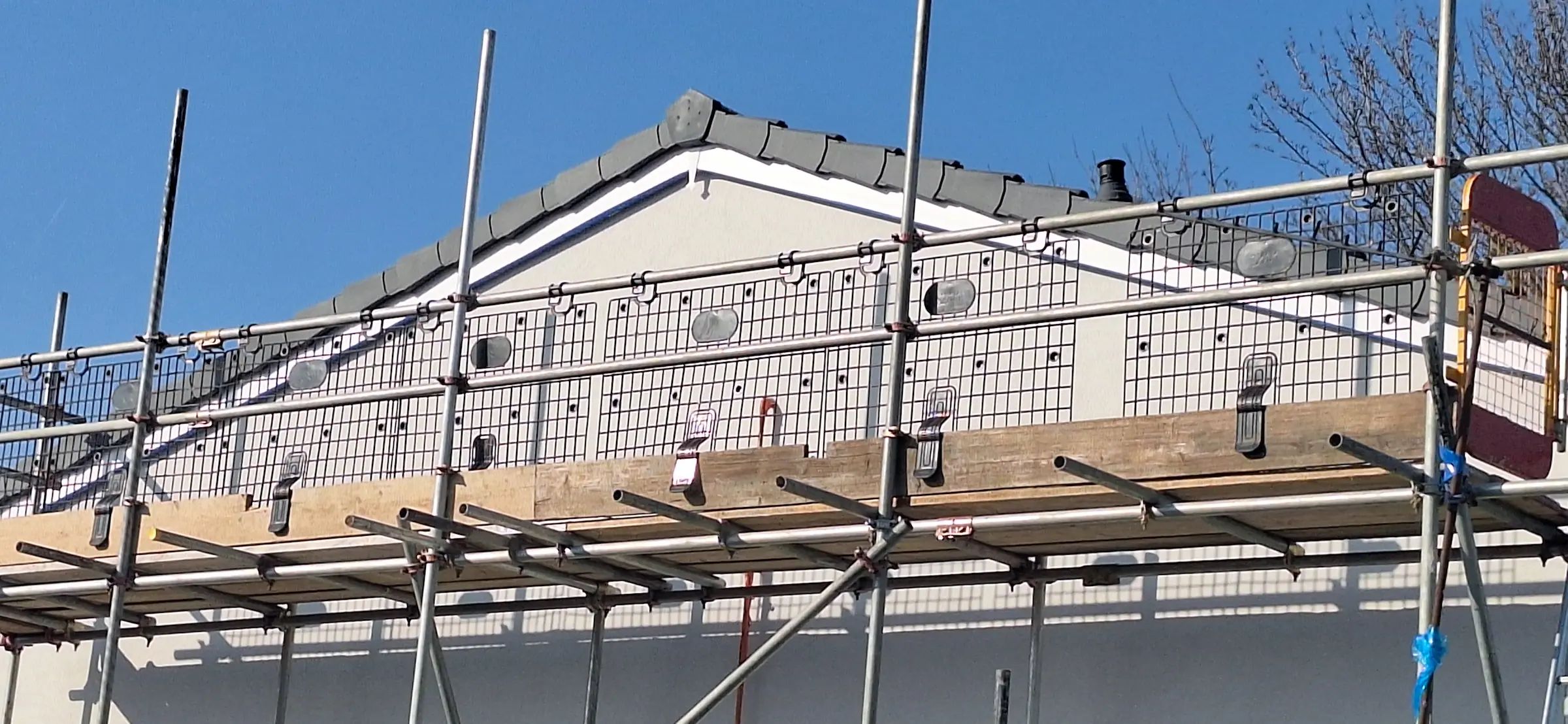 A building with scaffolding on top of it.